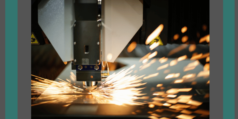 laser etching machine with sparks around it