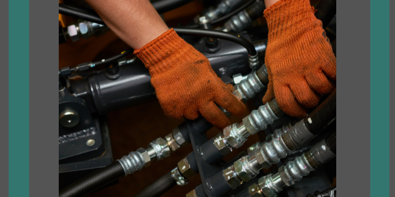 A man's hands in orange gloves working on swivels